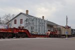 KRL 27104 carries the big transformer past the 1857 depot